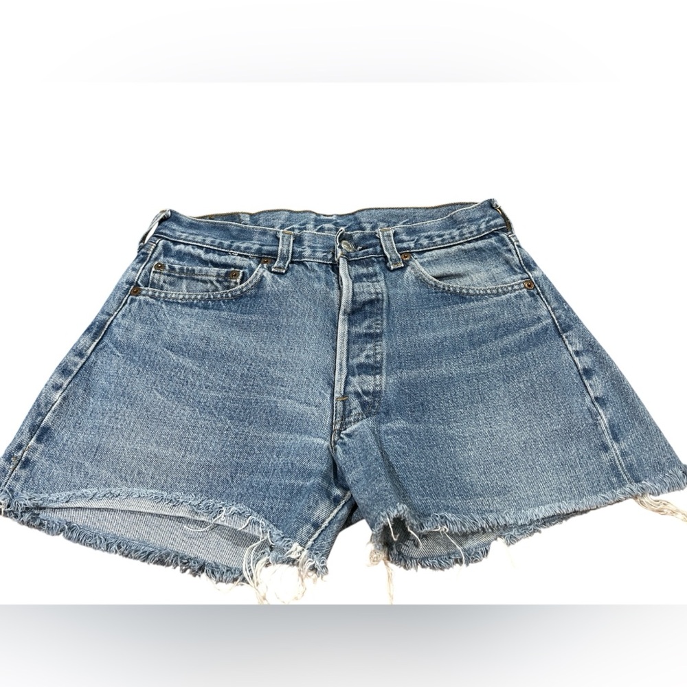 Levi’s 501 – Size 26 – button fly – raw hem cutoffs.